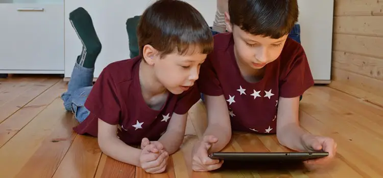 two kids using a tablet